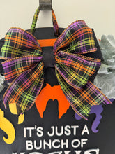 Load image into Gallery viewer, "Hocus Pocus" Halloween Door Hanger | Witch Hair Wood Sign with Plaid Bow | Orange & Black Striped Round Sign | Fall Front Door Decor