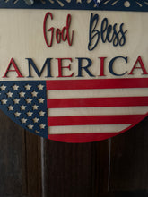 Load image into Gallery viewer, God Bless America Door Hanger | 19&quot; Patriotic Round Sign | Hand Painted Birch Wood | 4th of July Front Door Decor
