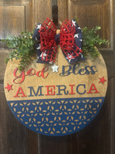 Load image into Gallery viewer, God Bless America Door Hanger | 19&quot; Patriotic Round Sign | Hand Painted Birch Wood | 4th of July Front Door Decor
