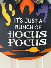 Load image into Gallery viewer, "Hocus Pocus" Halloween Door Hanger | Witch Hair Wood Sign with Plaid Bow | Orange &amp; Black Striped Round Sign | Fall Front Door Decor

